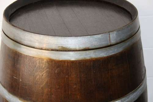 An incredible original solid French oak wine barrel with its original hoops in great condition