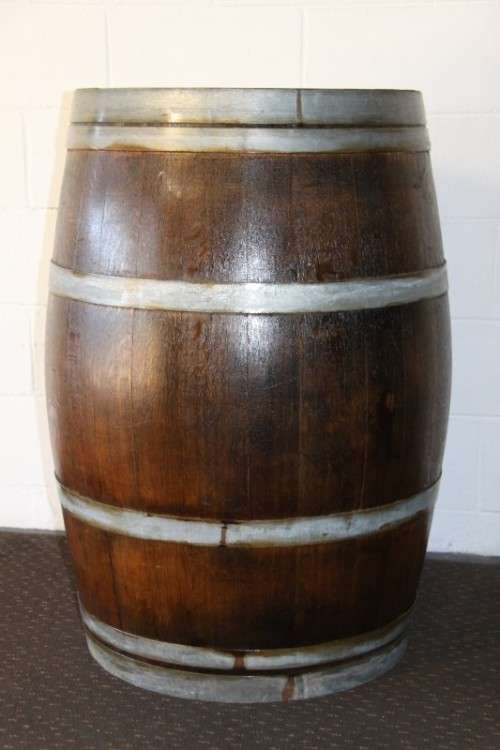 An incredible original solid French oak wine barrel with its original hoops in great condition