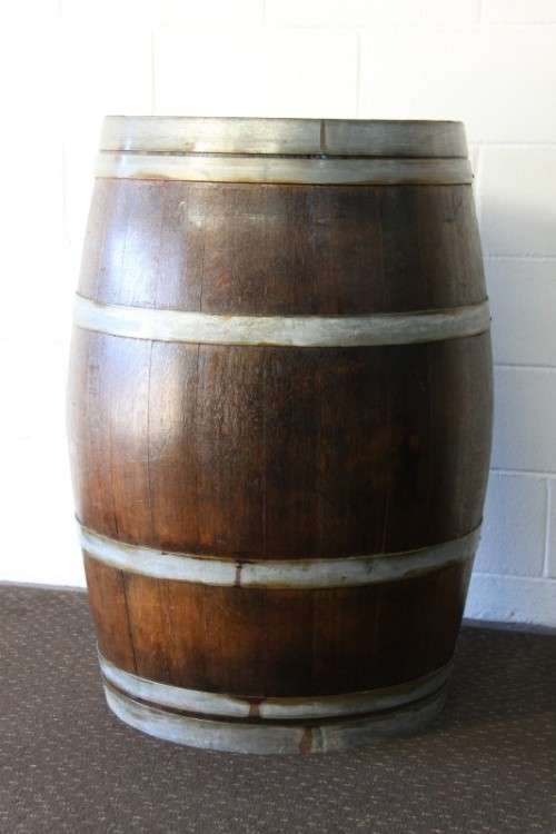 An incredible original solid French oak wine barrel with its original hoops in great condition