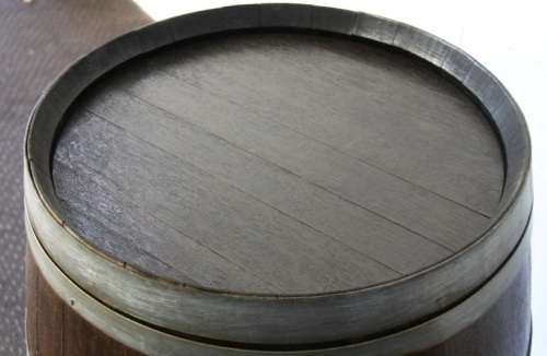 An incredible original solid French oak wine barrel with its original hoops in great condition