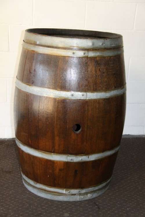 An incredible original solid French oak wine barrel with its original hoops in great condition