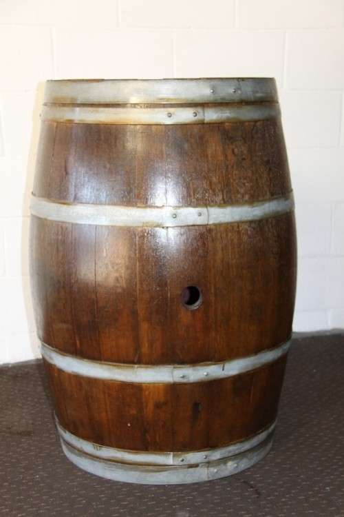 An incredible original solid French oak wine barrel with its original hoops in great condition
