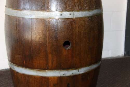 An incredible original solid French oak wine barrel with its original hoops in great condition