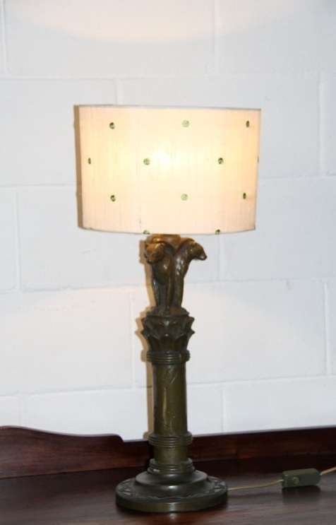 An exquisite tall "Leopard" moulded table lamp and shade with beautiful detailing in working order