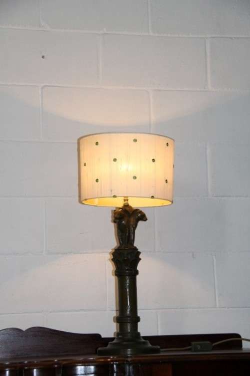 An exquisite tall "Leopard" moulded table lamp and shade with beautiful detailing in working order