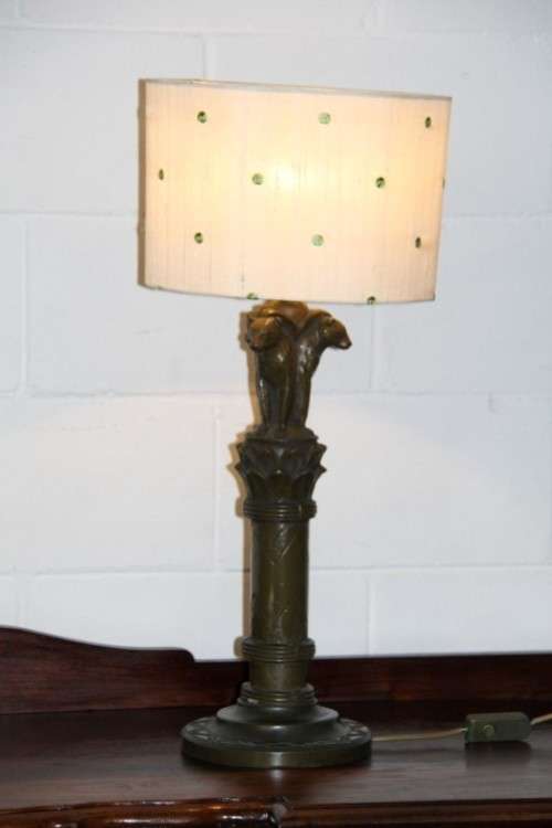 An exquisite tall "Leopard" moulded table lamp and shade with beautiful detailing in working order