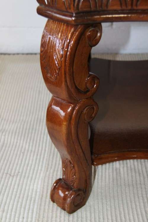 An awesome wooden centre coffee table with stunning inlay detailing and carved legs