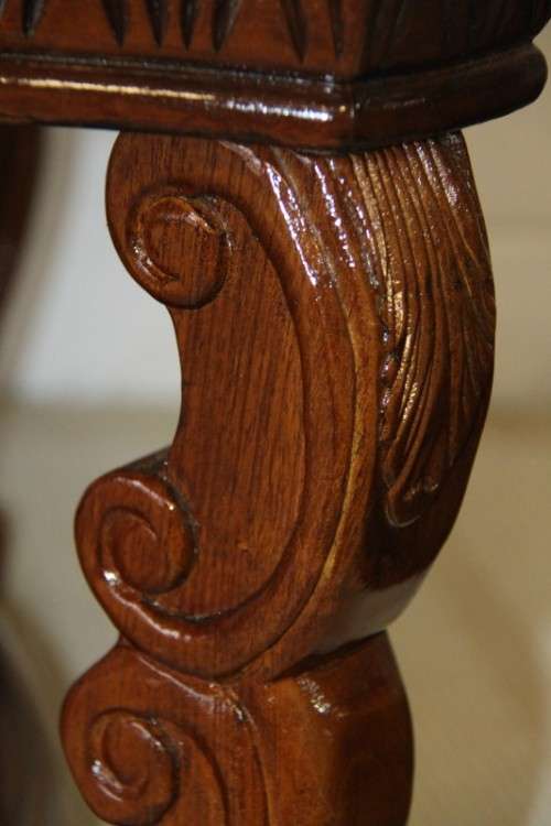 An awesome wooden centre coffee table with stunning inlay detailing and carved legs