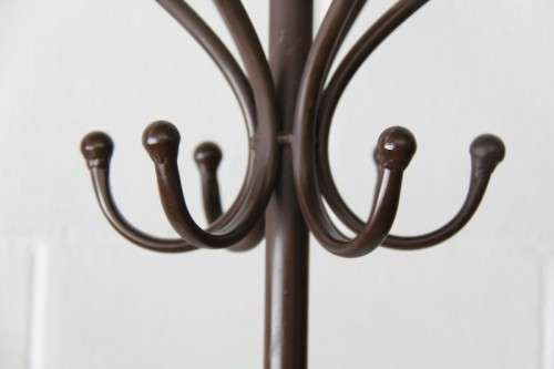 A stunning tall wrought iron coat rack/ hat stand with loads of space in very good condition