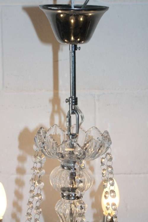 A superb and expensive crystal chandelier with curved glass arms and 6x light fittings = wow!!!