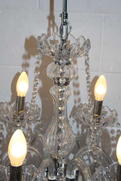 A superb and expensive crystal chandelier with curved glass arms and 6x light fittings = wow!!!