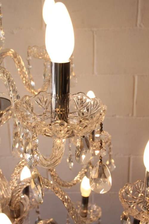 A spectacular three-tier crystal chandelier with curved glass arms and 21x light fittings = WOW!!