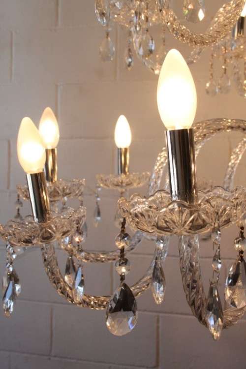 A spectacular three-tier crystal chandelier with curved glass arms and 21x light fittings = WOW!!