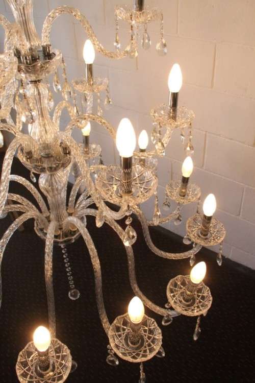 A spectacular three-tier crystal chandelier with curved glass arms and 21x light fittings = WOW!!