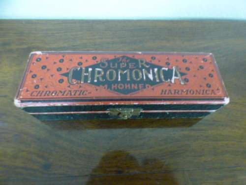A wonderful vintage (1957) German made M Hohner Super Chromonica harmonica in its original box.