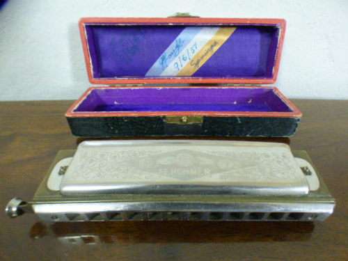 A wonderful vintage (1957) German made M Hohner Super Chromonica harmonica in its original box.