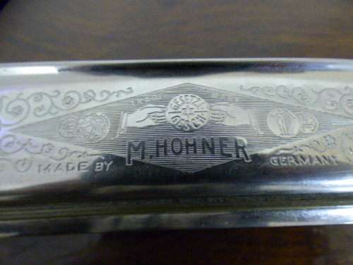 A wonderful vintage (1957) German made M Hohner Super Chromonica harmonica in its original box.