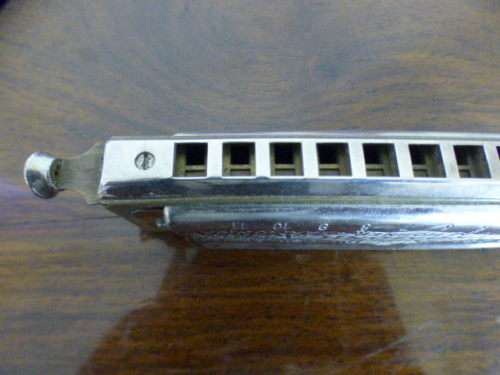 A wonderful vintage (1957) German made M Hohner Super Chromonica harmonica in its original box.
