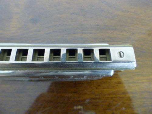 A wonderful vintage (1957) German made M Hohner Super Chromonica harmonica in its original box.