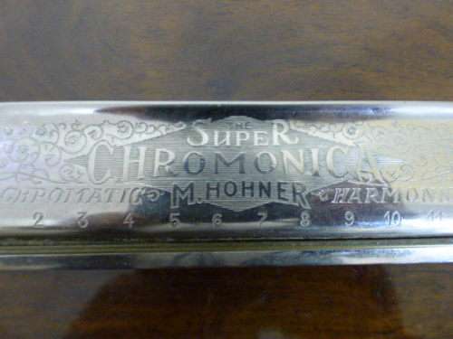 A wonderful vintage (1957) German made M Hohner Super Chromonica harmonica in its original box.