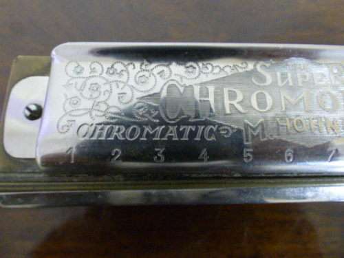 A wonderful vintage (1957) German made M Hohner Super Chromonica harmonica in its original box.