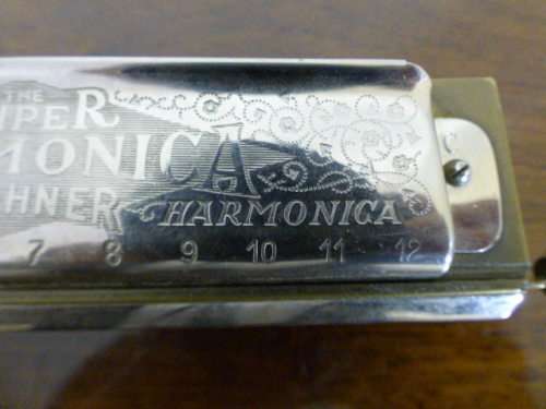 A wonderful vintage (1957) German made M Hohner Super Chromonica harmonica in its original box.