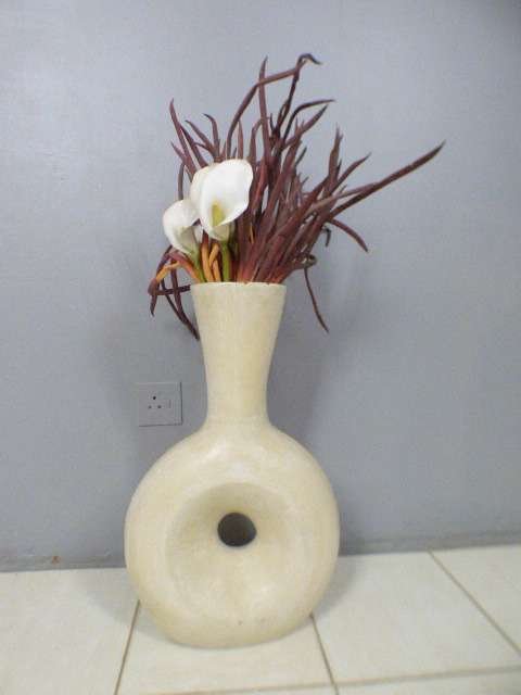 A beautiful HUGE floor standing ceramic vase. Gorgeous on its own or w/ large flower cuttings.