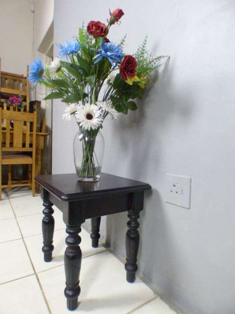 A gorgeous, heavy dark wood occasional/ display/ side table, perfect in your living rooms!!