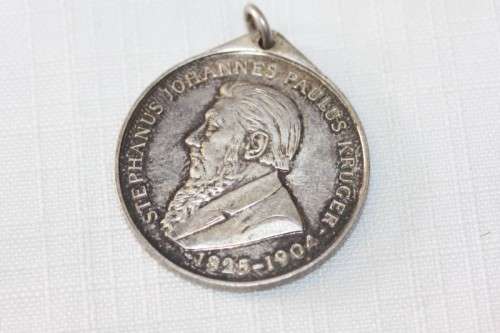 A 1954 "Kruger standbeeld verskuiwing" stamped sterling silver commemorative coin