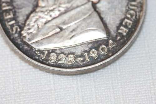 A 1954 "Kruger standbeeld verskuiwing" stamped sterling silver commemorative coin