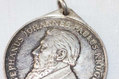 A 1954 "Kruger standbeeld verskuiwing" stamped sterling silver commemorative coin