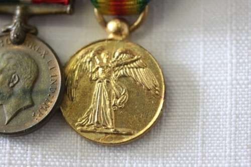 Four magnificent antique miniature ribboned military medals in very good condition