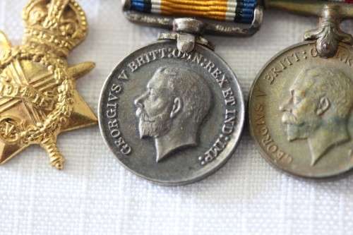 Four magnificent antique miniature ribboned military medals in very good condition