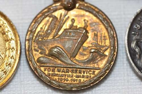 Four magnificent antique miniature ribboned military medals in very good condition