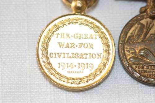Four magnificent antique miniature ribboned military medals in very good condition