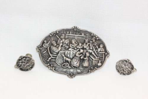 An incredible original antique Herbert Hooijkaas silver plated repousse brooch and earring set