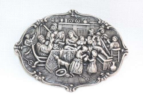 An incredible original antique Herbert Hooijkaas silver plated repousse brooch and earring set