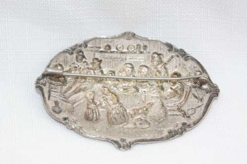An incredible original antique Herbert Hooijkaas silver plated repousse brooch and earring set