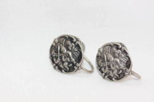 An incredible original antique Herbert Hooijkaas silver plated repousse brooch and earring set