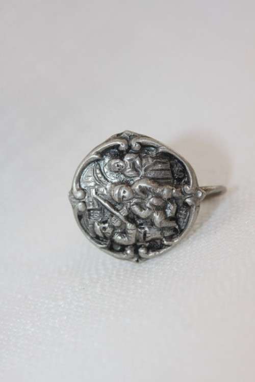 An incredible original antique Herbert Hooijkaas silver plated repousse brooch and earring set