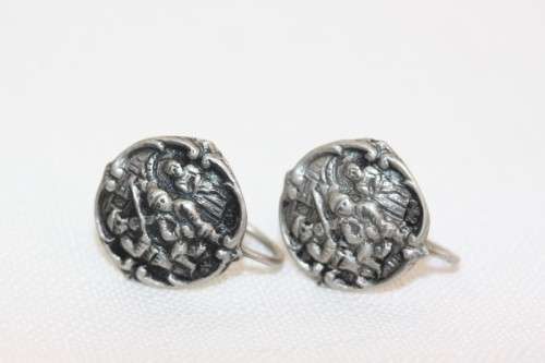An incredible original antique Herbert Hooijkaas silver plated repousse brooch and earring set