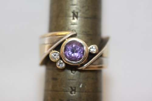 A beautiful 14ct yellow gold and sterling silver ladies ring w/ diamonds and a large Amethyst stone