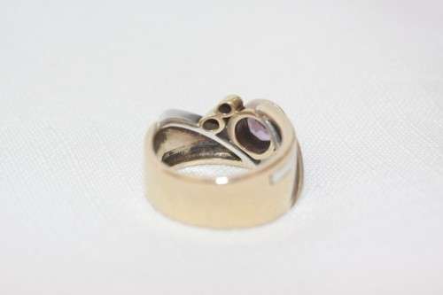 A beautiful 14ct yellow gold and sterling silver ladies ring w/ diamonds and a large Amethyst stone