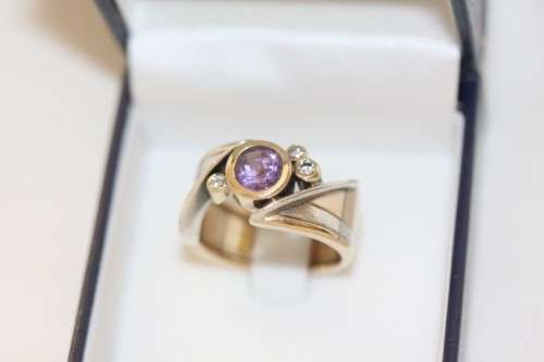 A beautiful 14ct yellow gold and sterling silver ladies ring w/ diamonds and a large Amethyst stone