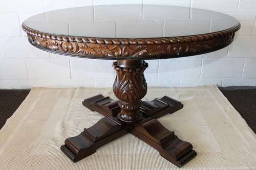 A very well made and heavy oak dining table w/ a wonderfully carved centre leg