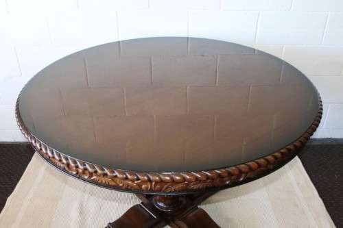 A very well made and heavy oak dining table w/ a wonderfully carved centre leg