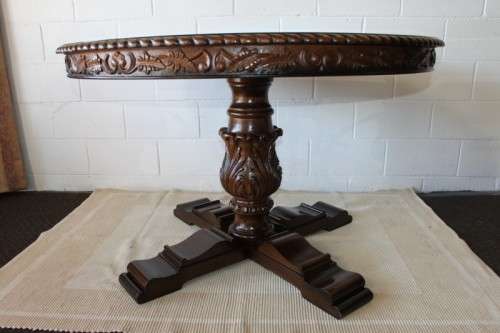 A very well made and heavy oak dining table w/ a wonderfully carved centre leg