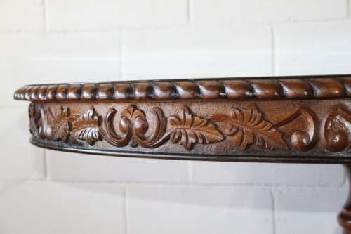 A very well made and heavy oak dining table w/ a wonderfully carved centre leg