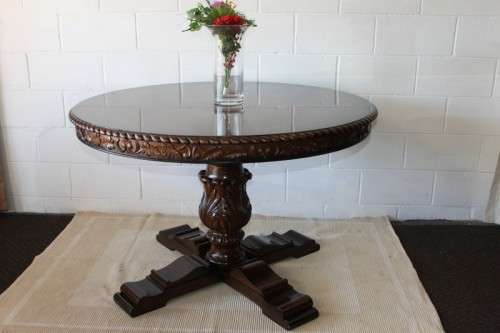 A very well made and heavy oak dining table w/ a wonderfully carved centre leg