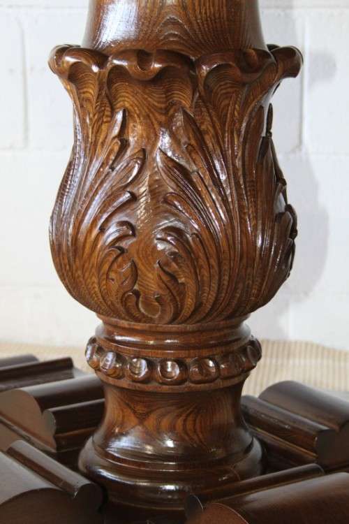 A very well made and heavy oak dining table w/ a wonderfully carved centre leg